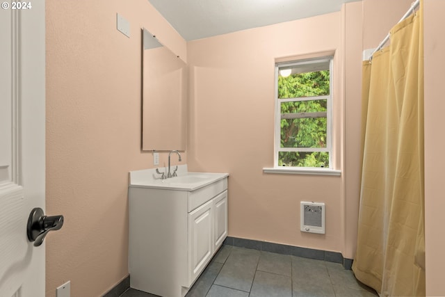 bathroom with vanity, tile patterned floors, and heating unit