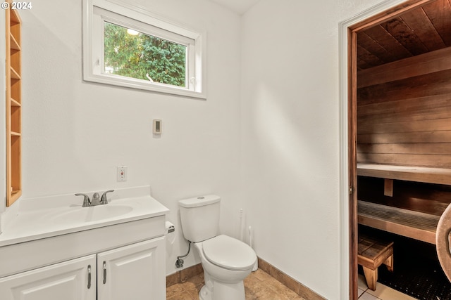 bathroom featuring tile patterned floors, vanity, and toilet