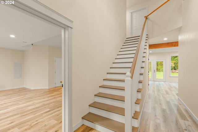 staircase with wood-type flooring