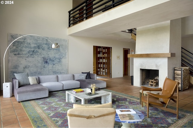 living room with tile patterned flooring and a high ceiling