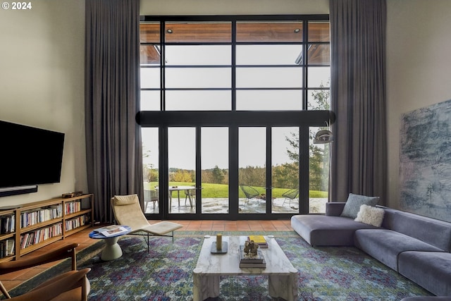 living room featuring tile patterned flooring and plenty of natural light