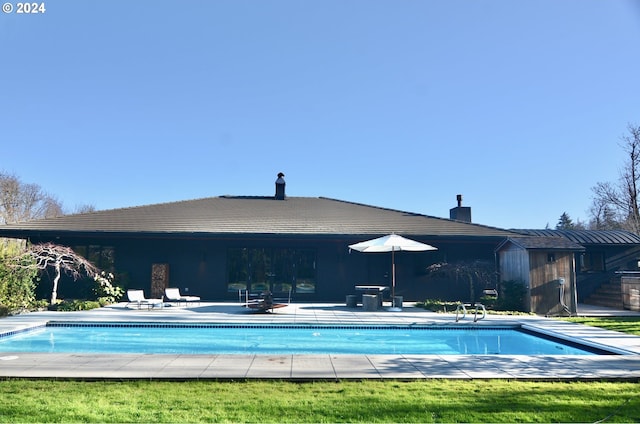 view of swimming pool with a patio area