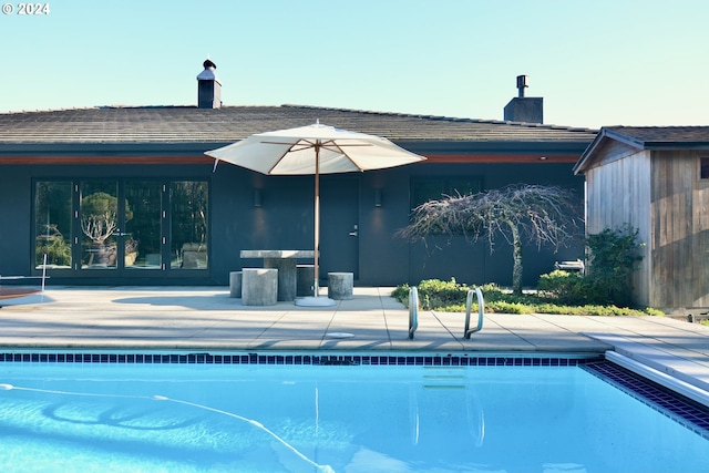 view of swimming pool with a patio area