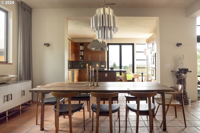 dining room with light tile patterned floors and sink