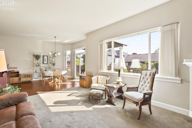 interior space featuring a notable chandelier and carpet