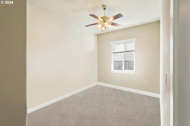 empty room featuring light carpet and ceiling fan