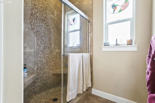 bathroom featuring tile patterned flooring and walk in shower