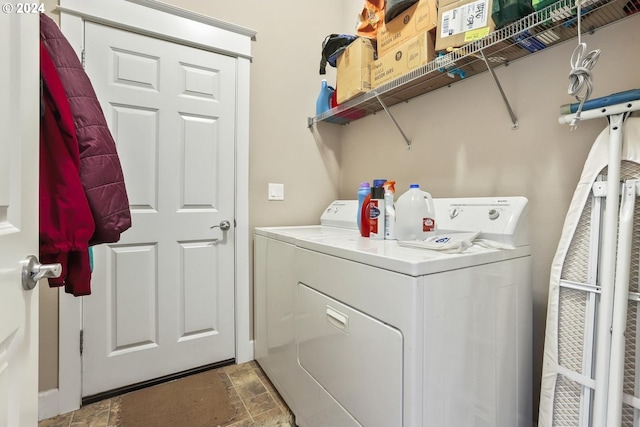 laundry room featuring washing machine and clothes dryer