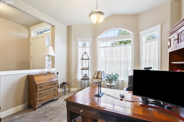 office featuring vaulted ceiling and light colored carpet