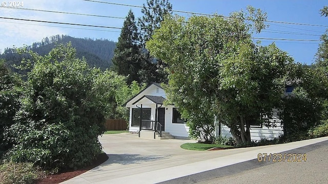 view of front of property with a mountain view