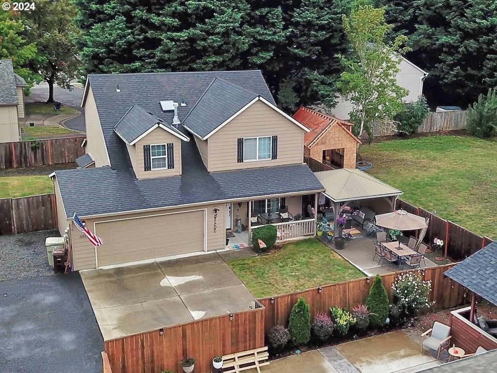 view of front facade with a front yard and a patio