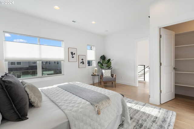 bedroom with light wood-type flooring