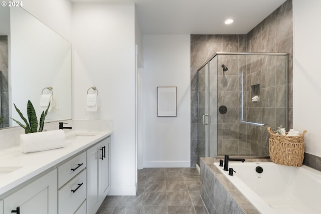 bathroom with separate shower and tub, tile patterned flooring, and vanity