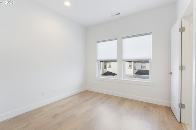 empty room with light wood-type flooring