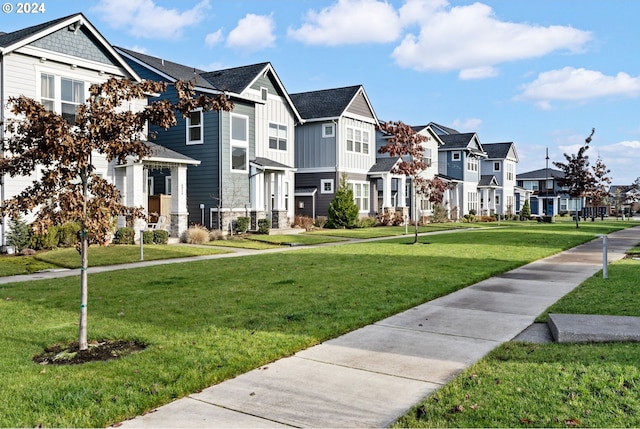 view of community featuring a yard