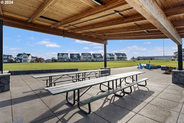 view of property's community featuring a yard