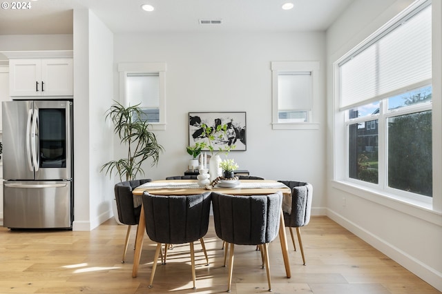 dining area with light hardwood / wood-style flooring