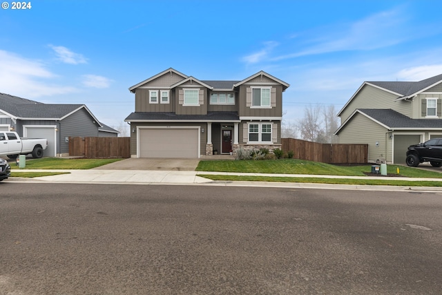 view of front of house featuring a front yard and a garage