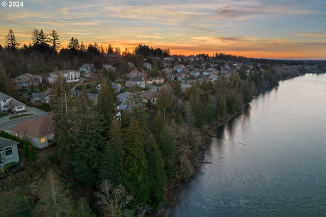 aerial view at dusk with a water view