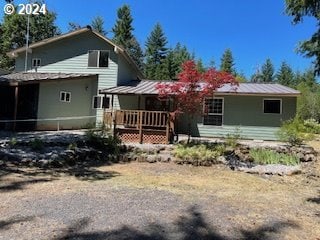 rear view of house with a deck