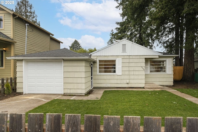 view of front of home with a garage and a front lawn