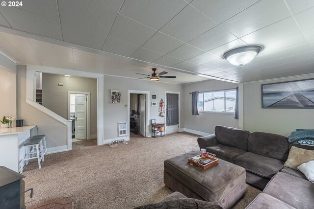 living room with carpet floors and ceiling fan