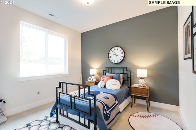 bedroom with light colored carpet