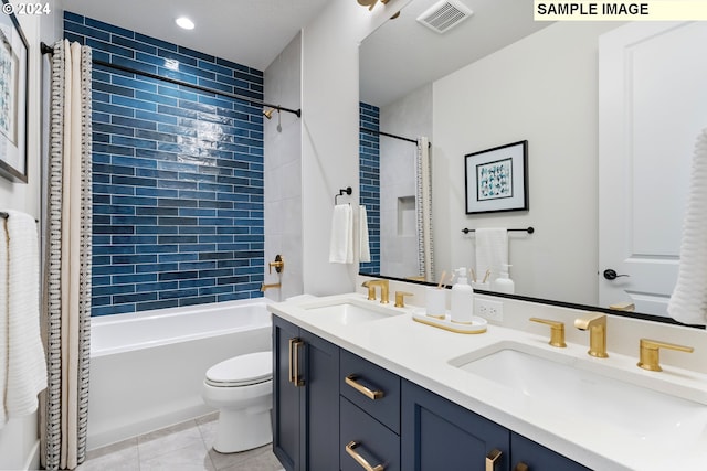 full bathroom with vanity, shower / tub combo with curtain, tile patterned floors, and toilet