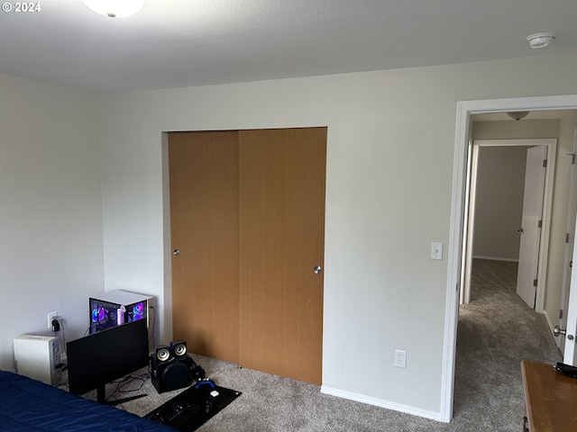 carpeted bedroom with a closet