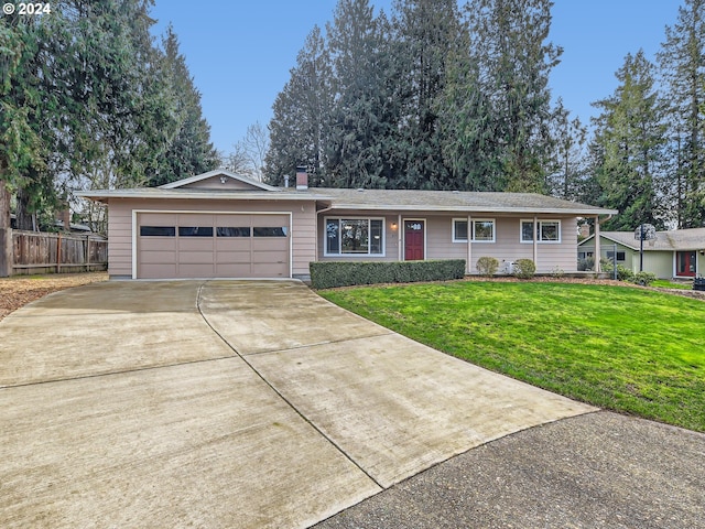 ranch-style house with a garage and a front lawn