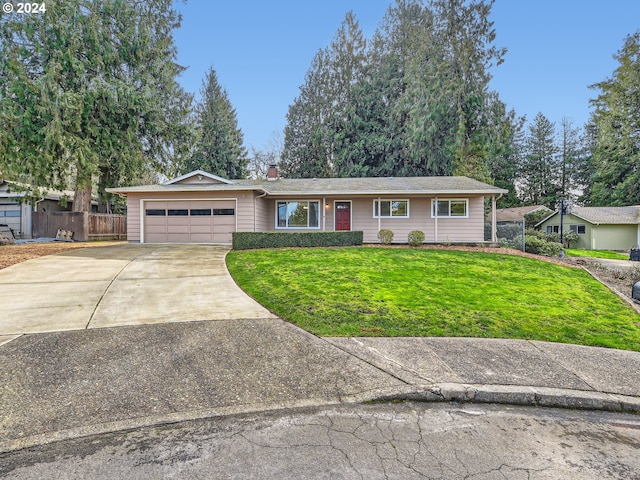 ranch-style home featuring a garage and a front yard