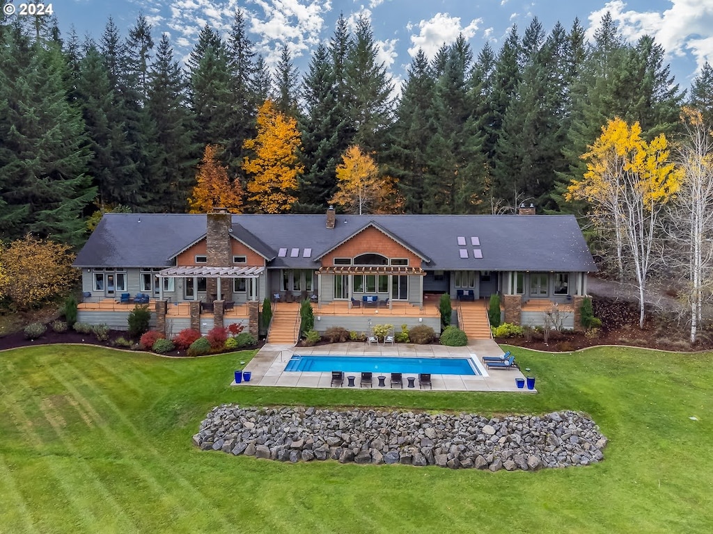 38920 Carr Trail Rd, Dexter, OR 97431 - back of property featuring a pool side deck and a lawn
