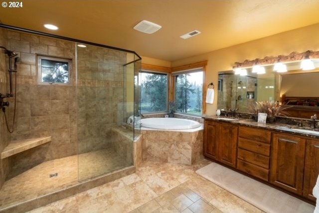 bathroom featuring plus walk in shower and vanity