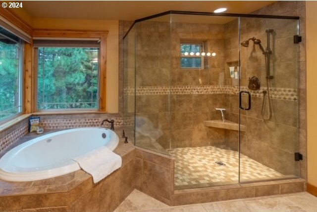 bathroom featuring independent shower and bath and tile patterned floors