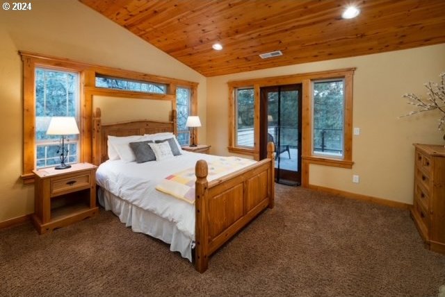 bedroom with dark colored carpet, lofted ceiling, and wooden ceiling