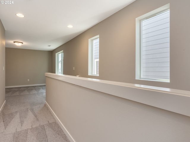 corridor featuring recessed lighting, baseboards, and carpet floors