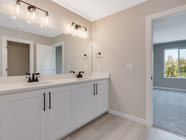 bathroom with vanity and hardwood / wood-style flooring