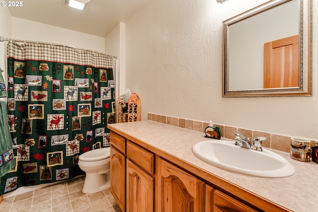 bathroom featuring vanity, toilet, tile patterned flooring, and a shower with shower curtain