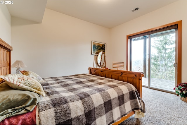 carpeted bedroom featuring access to exterior