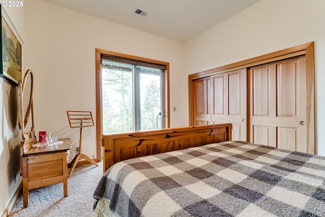 bedroom featuring light colored carpet