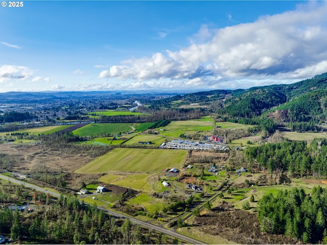 drone / aerial view with a rural view and a mountain view