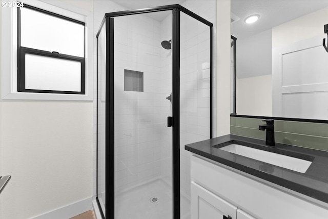 bathroom with vanity and walk in shower