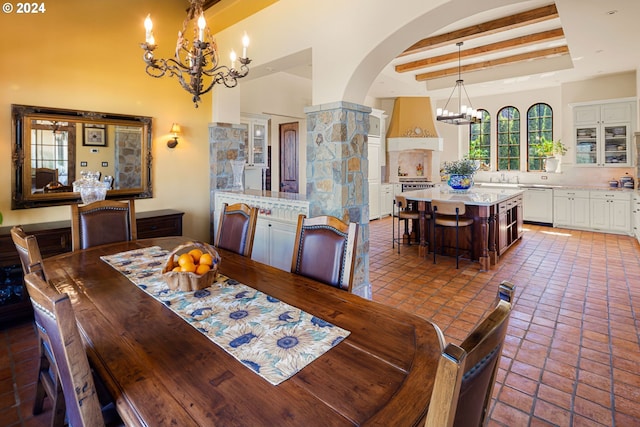 4974 W 44th Ave, Eugene, OR 97405 - dining area featuring a chandelier, arched walkways, a tray ceiling, a towering ceiling, and beam ceiling