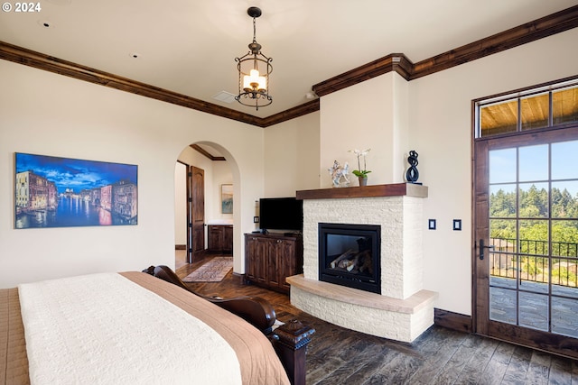 4974 W 44th Ave, Eugene, OR 97405 - bedroom with ornamental molding, hardwood / wood-style floors, access to outside, baseboards, and a glass covered fireplace