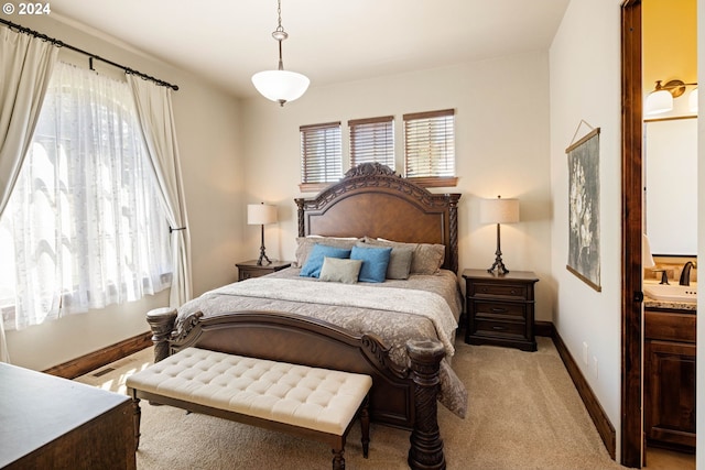 4974 W 44th Ave, Eugene, OR 97405 - bedroom featuring light colored carpet, baseboards, and a sink