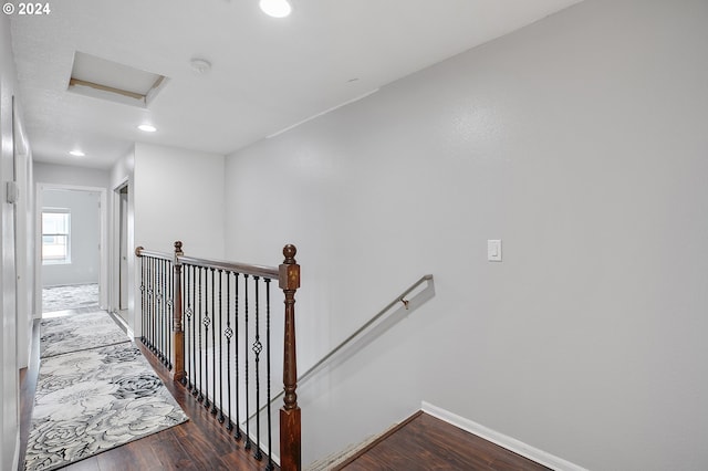 staircase featuring hardwood / wood-style floors