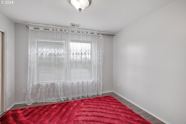 spare room featuring hardwood / wood-style flooring