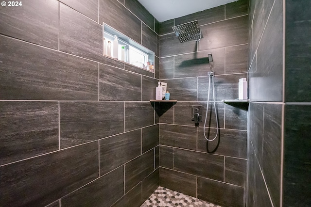 bathroom with tiled shower