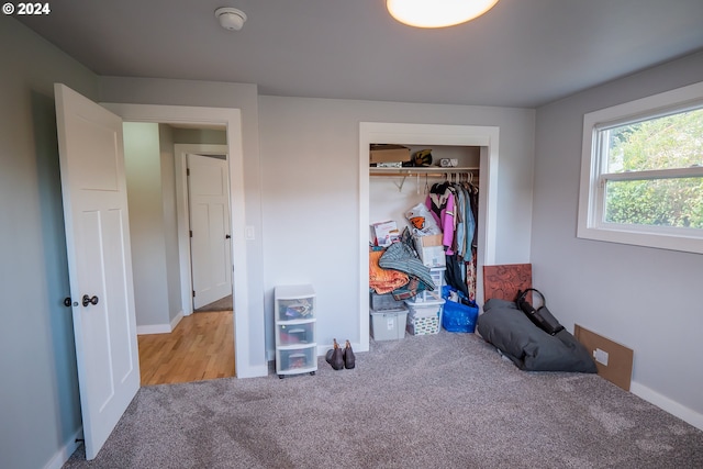 carpeted bedroom featuring a closet