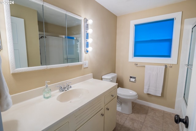 full bathroom with tile patterned flooring, vanity, toilet, and enclosed tub / shower combo